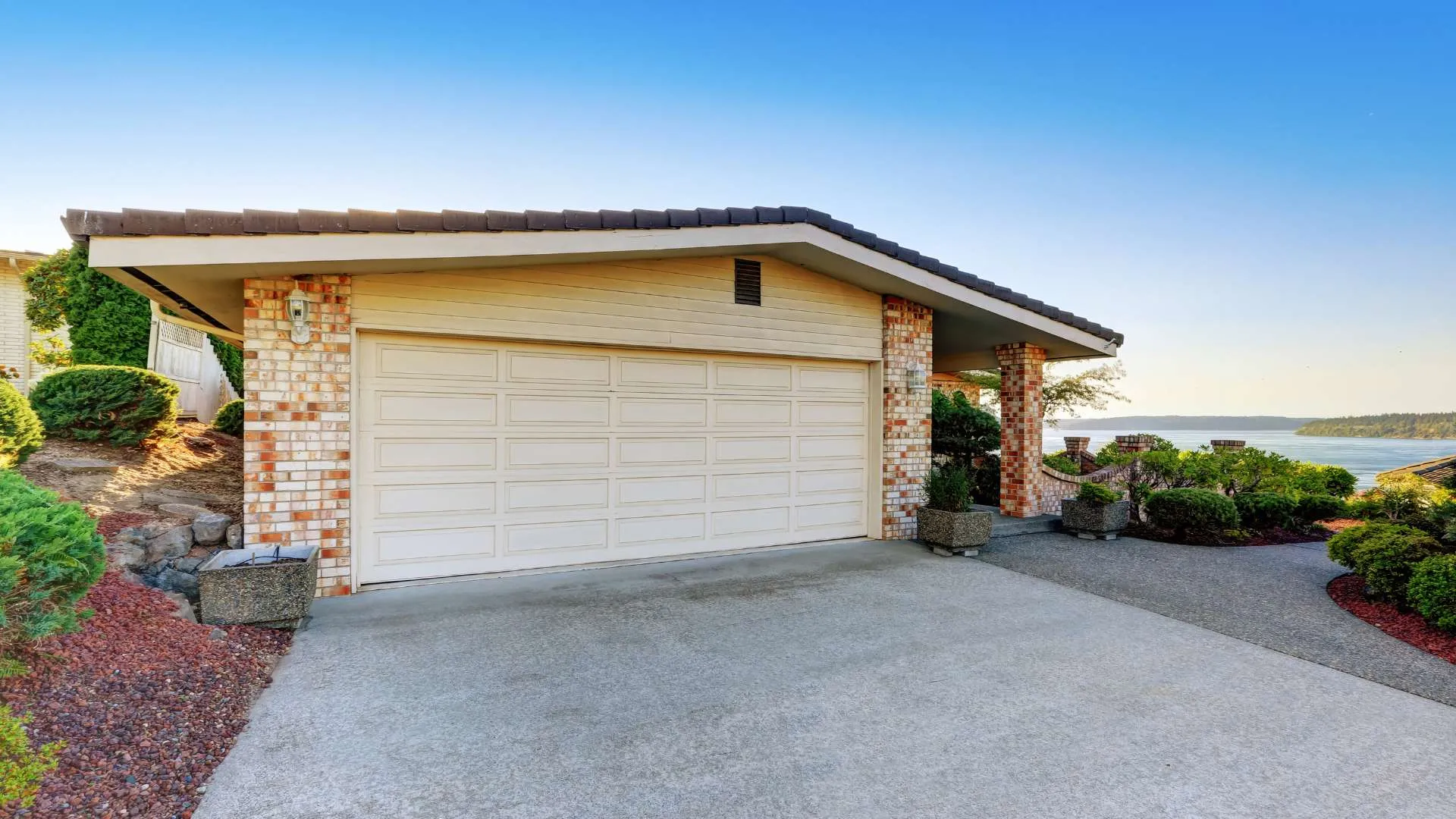 Clean, sealed concrete driveway in front of a Colorado home